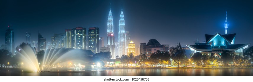 Night scenery view of Kuala Lumpur skyline from The Palace of Culture and park with dancing fountain, Malaysia