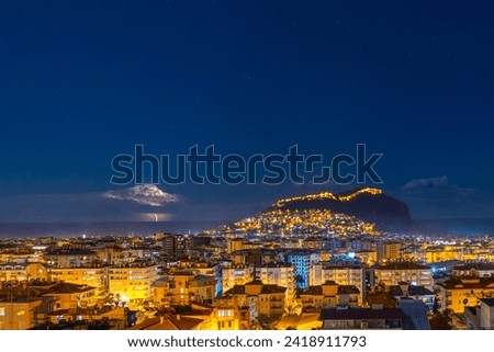 night sea and city landscape and lightning