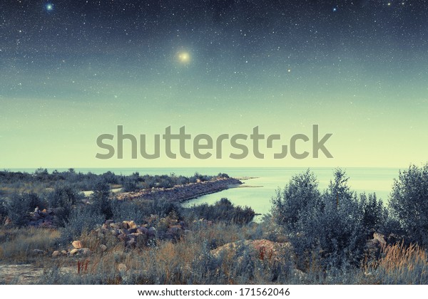 night\
at sea. Elements of this image furnished by NASA\
