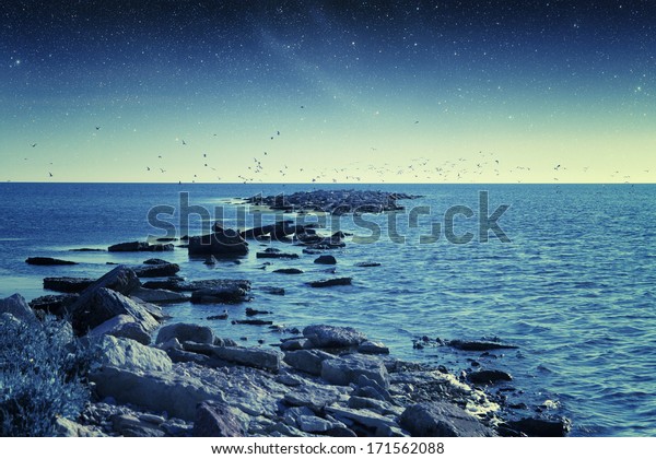night\
at sea. Elements of this image furnished by NASA\
