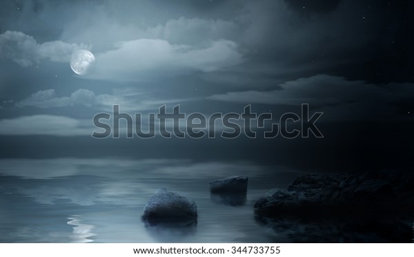 Night sea under cloudy\
sky