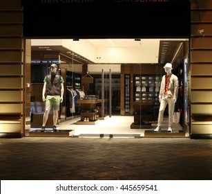 Night Shop Window With Men Dressed Mannequins