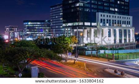 A night shot in the busy street of Sandton Grayston Drive