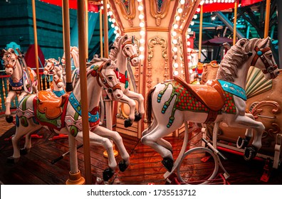 A night shot of a merry Go round, on a rainy night. 