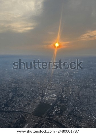 Night sky with dramatic clouds above an airplane