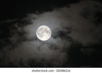 Night Sky And A Full Moon In The Clouds