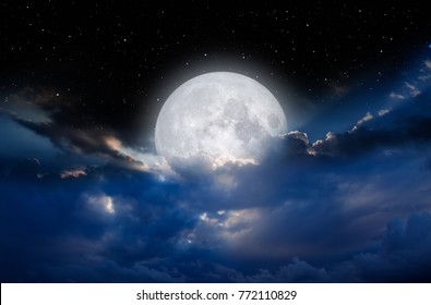 Night sky with full moon in the clouds "Elements of this image furnished by NASA" - Powered by Shutterstock