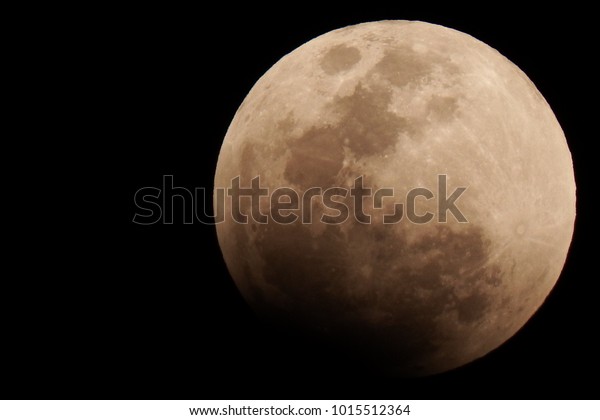 Night sky and a full moon.\
Super Blue Blood Moon 2018: Super Blue Blood Moon due to a Lunar\
Eclipse.