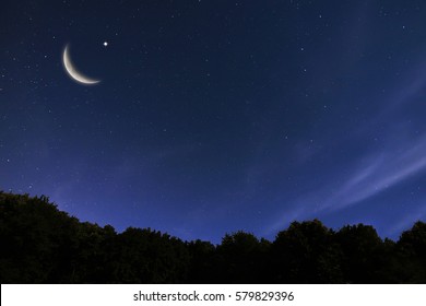 Night sky landscape and moon, stars, Ramadan Kareem celebration - Shutterstock ID 579829396