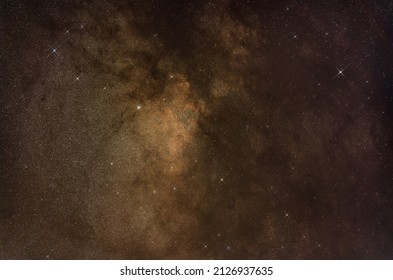 Night sky with milky way near Scutum constellation, brightest star on right is Eta Serpentis, small group of stars in middle Wild duck cluster. Long exposure astro photo