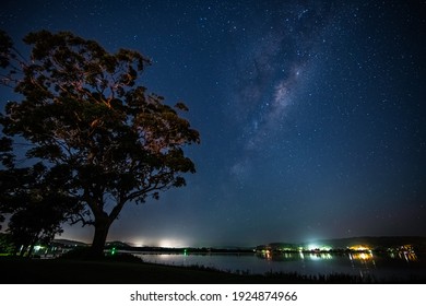 The night sky with Milky Way at Woy Woy Waterfront on the Central Coast of NSW, Australia.