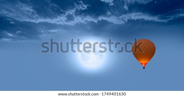 Night sky with moon in the
clouds 
 with hot air balloon 