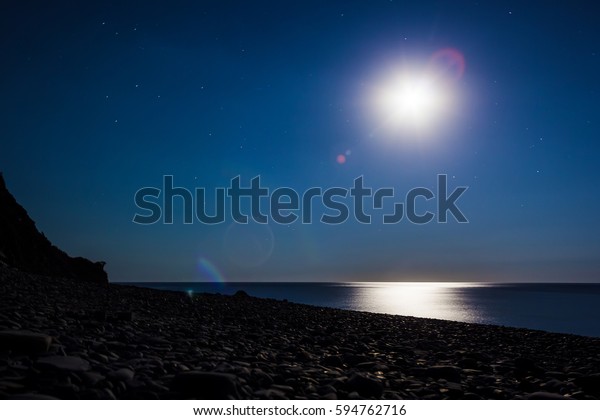 Night sky, moon and\
sea