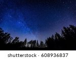 Night sky over rural landscape. Beautiful night starry sky, high ISO landscape. 