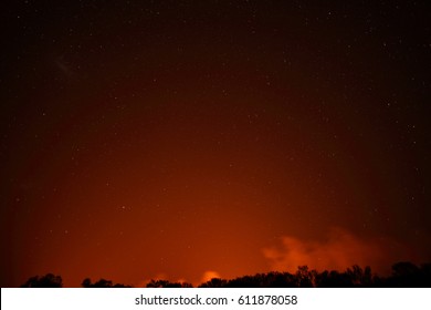 The Night Sky With Stars Over The West Macdonnell Ranges Near Alice Springs With The Red Glow Of A Bushfire.