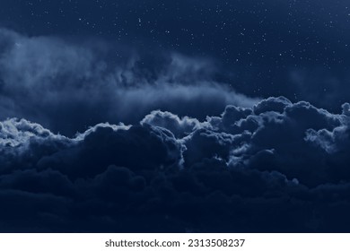 Night sky with stars and strong clouds as seen from above