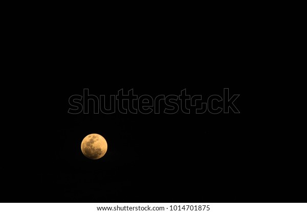 Night Sky, Super\
Blue Moon, Blood In the dark\
Bloody moon Appears on the big night\
sky while approaching\
Earth.