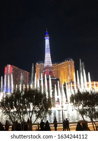 Night skyline of Las Vegas strip with a view of Bellagio fountain in the front of Paris hotel