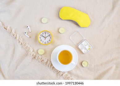 Night Sleep Concept With Accessories. Flat Lay Composition With Sleep Eye Mask,  Alarm Clock, Scented Candles. Healthy Night Sleep, Quality Of Sleep Night Time Routine, Aromatherapy. Top View  