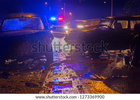 Night slippy road car accident. Car crash in police light
