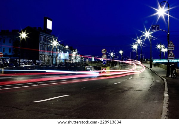 Night speed on the\
asphalt road in the city 