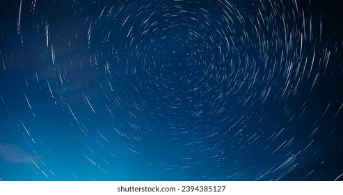 Night Starry Sky. Trails Of Stars Rotate. Dawn Is Coming. Daybreak Sky. Soft Blue-orange-pink Colours. Spin Trails Of Stars On Night Sky Background. Unusual Amazing Effects In Sky. Large Exposure - Powered by Shutterstock