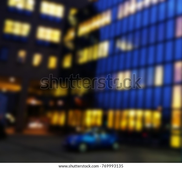 Night street
with cars and office building fasade.Lighting windows and working
people.view from window high-rise buildings at night with
illumination and moving cars with blur
light