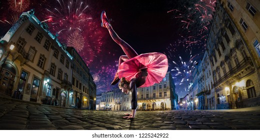 Night Street Circus Performance Whit Clown, Juggler. Festival City Background. Fireworks And Celebration Atmosphere. Wide Engle Photo