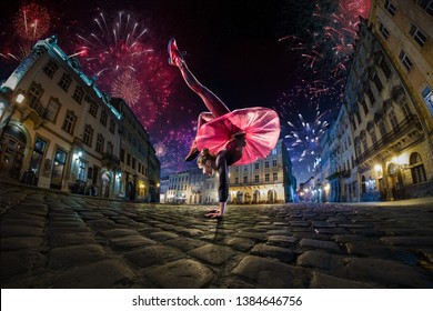 Night Street Circus Performance Whit Clown, Juggler. Festival City Background. Fireworks And Celebration Atmosphere. Wide Engle Photo