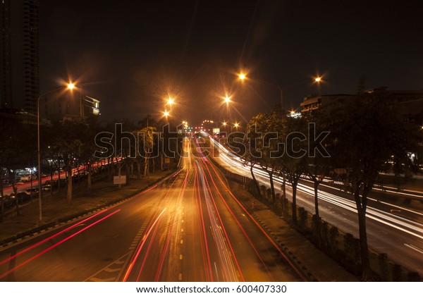 Night street\
road with speed line in Bangkok.\
