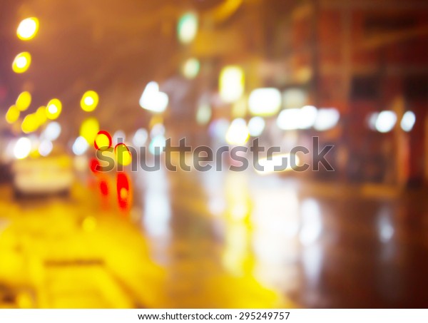 At night\
the streets of rain with bokeh\
background