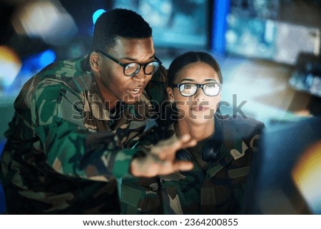 Night surveillance, army and people with a computer for communication, planning strategy or teamwork. Cyber security, data center and a black man talking to a woman about monitor in a military room