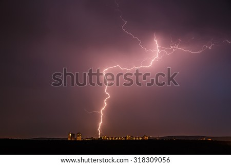 Night thunder lightning over the city sky view