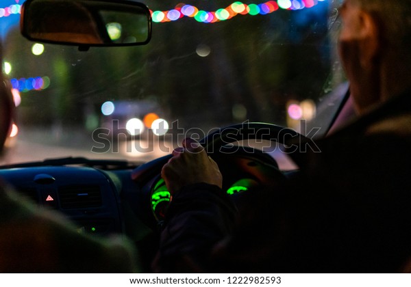 night time city taxi\
driver drive car 