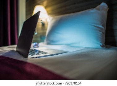 Night Time Internet Browsing. Modern Laptop Computer on the Bed. Browsing Network Before Sleep. Sleepless Night Concept.