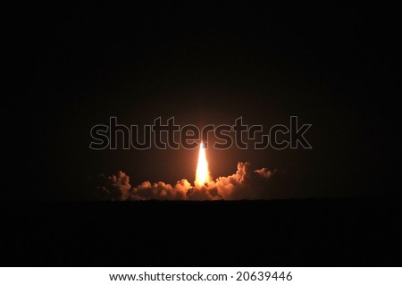 Night time launch of space shuttle