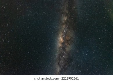 A night time photo of the Milky Way galactic core and detailed surrounding nebula against a dark starry sky in the southern hemisphere of Australia.