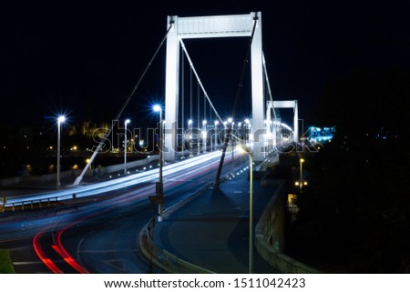 Night time traffic over the Elisabeth bridge which crosses the Danube river, connecting both Buda and Pest together. Budapest, Hungary.
