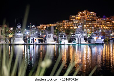 Night Time View Of The Cabo San Lucas Marina And Skyline.