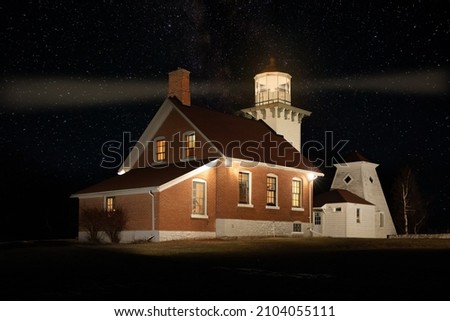 Night time view Sherwood Point Lighthouse at the entrance to Sturgeon Bay, Lake Michigan in Door County, Wisconsin.  Lighthouse is located in the town of  Idlewild.