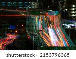 A night timelapse of the traffic jam at the urban street in Tokyo long shot. High quality photo. Shinagawa district Tokyo Japan 04.22.2022 Here is highway side in Tokyo. Translation on billboards text