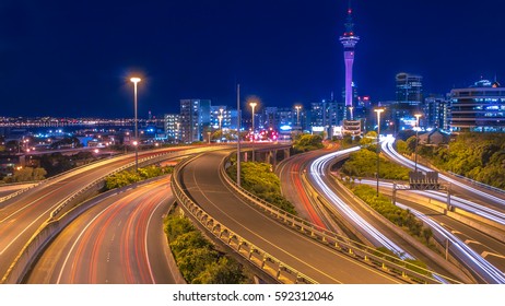 Night Traffic With Auckland City Centre On The Horizon, New Zealand