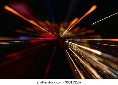 Night Traffic In The City, Car Lights In Motion Blur With Zoom Effect