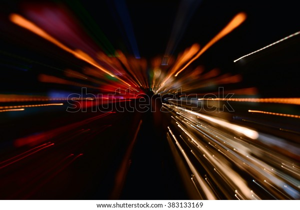 Night traffic in the city, car lights in motion\
blur with zoom effect