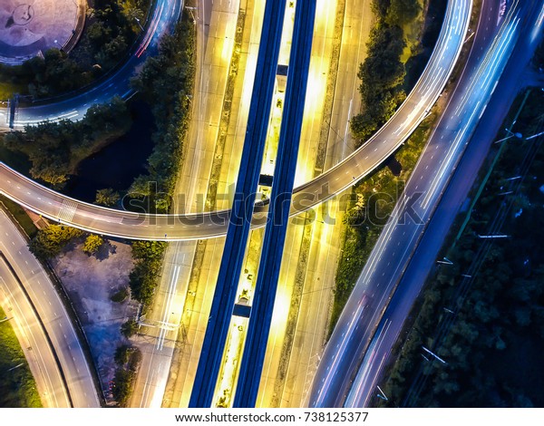 Night traffic intersection to the modern city  car\
movement bird eye top\
view