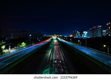 A Night Traffic Jam At The Urban Street In Tokyo Wide Shot. High Quality Photo. Shinagawa District Tokyo Japan 04.22.2022 Here Is Highway Side In Tokyo. Translation On Billboards Text Area Name.