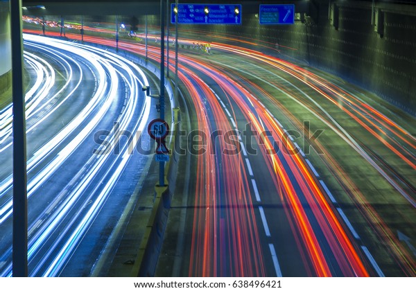 night traffic on the highway, light trace from\
the traffic