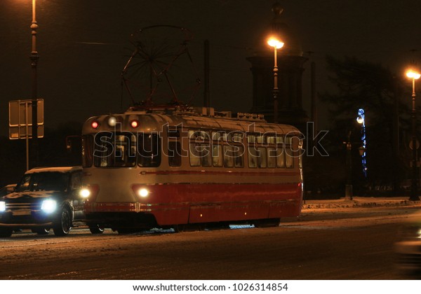 night tram outdoors in a\
blizzard