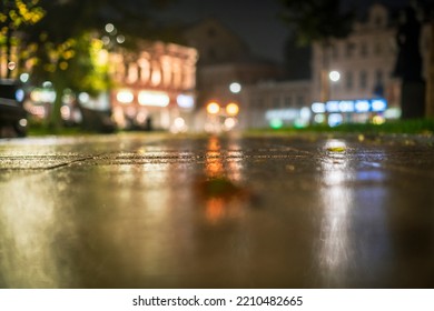 Night urban landscape, colored lights reflected in the wet asphalt in fall. Rainy night street in the city.
The lights of a rainy night in the autumn city of disfocus and bokeh. Neon street illuminati