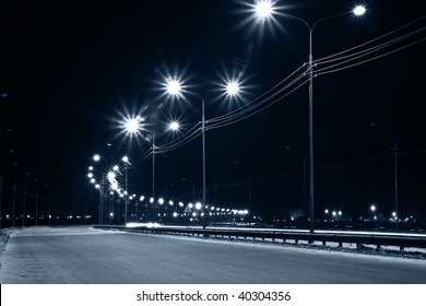 Night urban street with lights from lanterns - Powered by Shutterstock